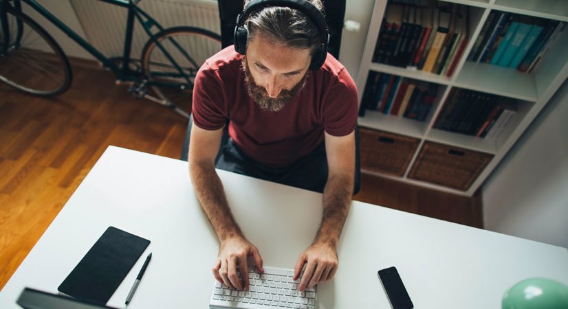 Birds eye view of a man typing